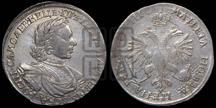 1 рубль 1718 года (портрет в латах, знак медальера ОК, инициалы минцмейстера L)