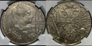 1 рубль 1734 года (голова меньше, крест короны делит надпись, одинарная складка над корсажем)